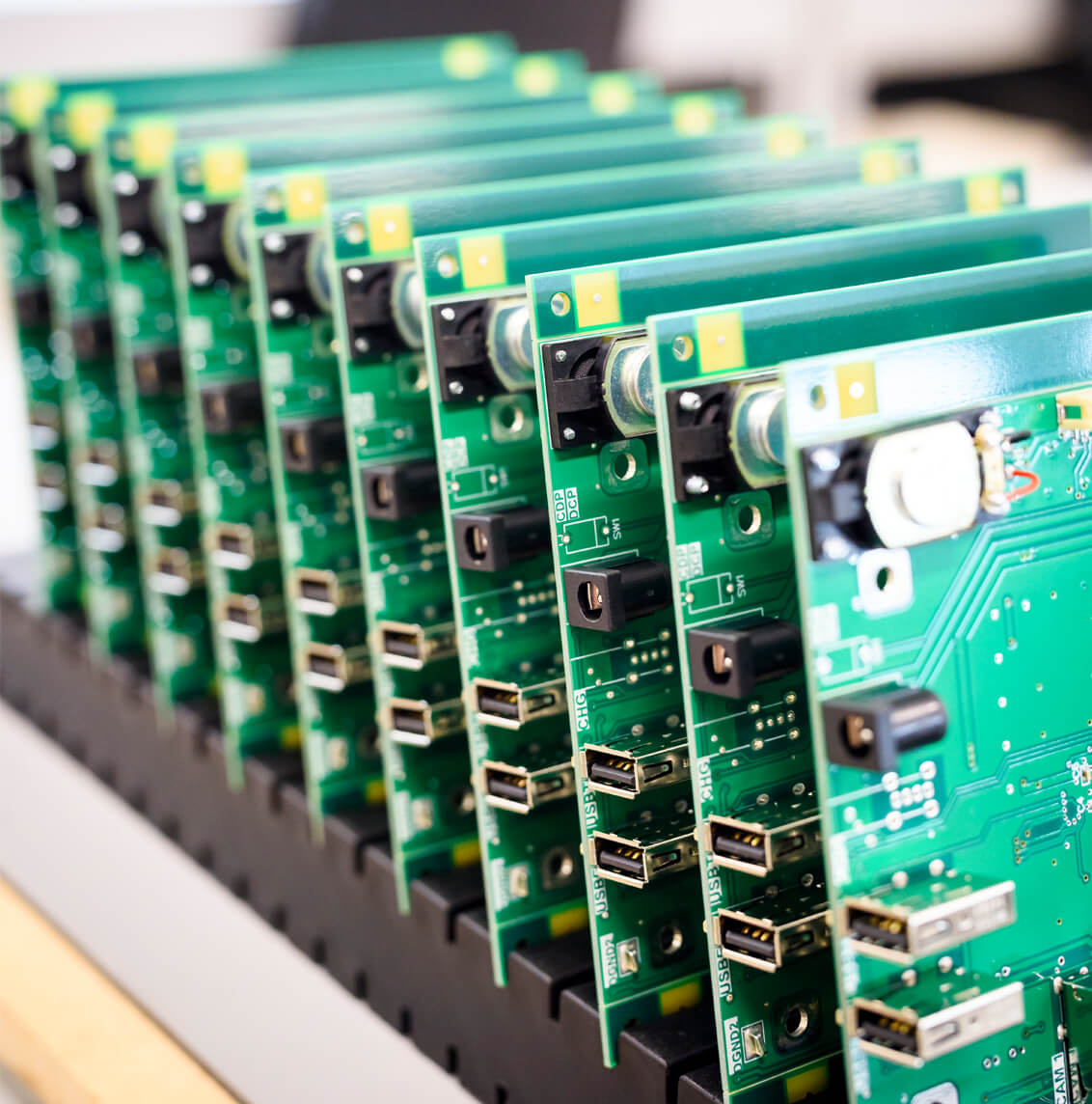 Rapier Electronics Adelaide - printed circuit board manufacturing pic of circuit boards stacked vertically on a rack