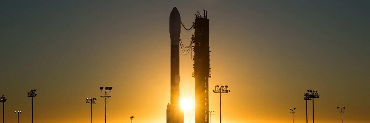 Rapier Electronics Adelaide - space electronics manufacturer pic of a rocket Silhouette ready for launch in the foreground of a beautiful orange sunset.